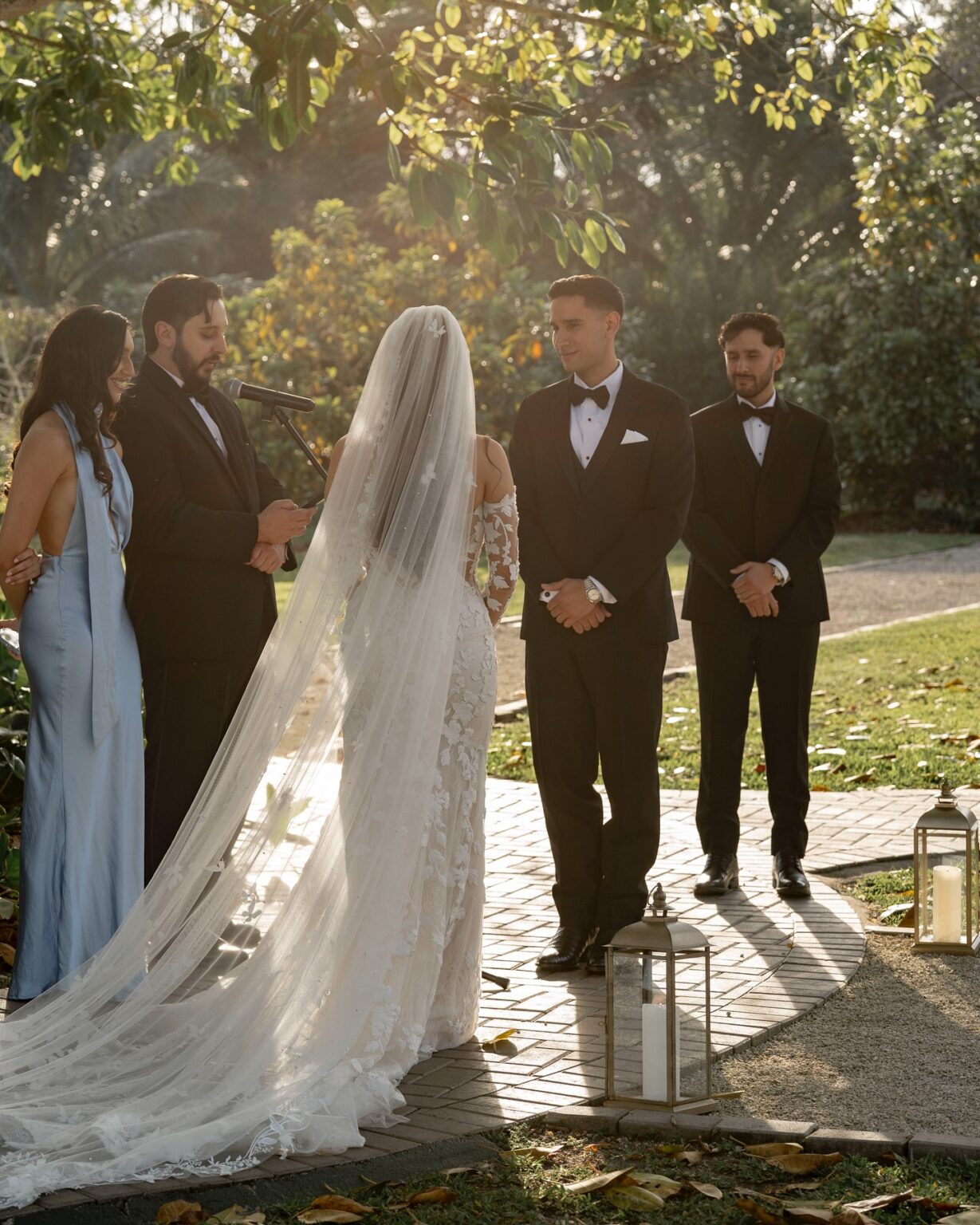 Outdoor wedding ceremony under the trees at Cinco Farm, Miami